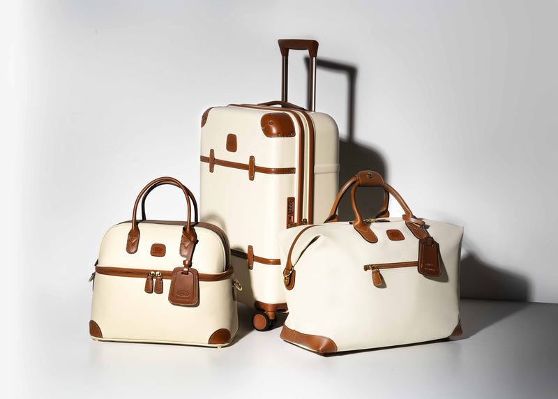 Cream Bric's Bellagio spinner with matching Bellagio duffle and handbag