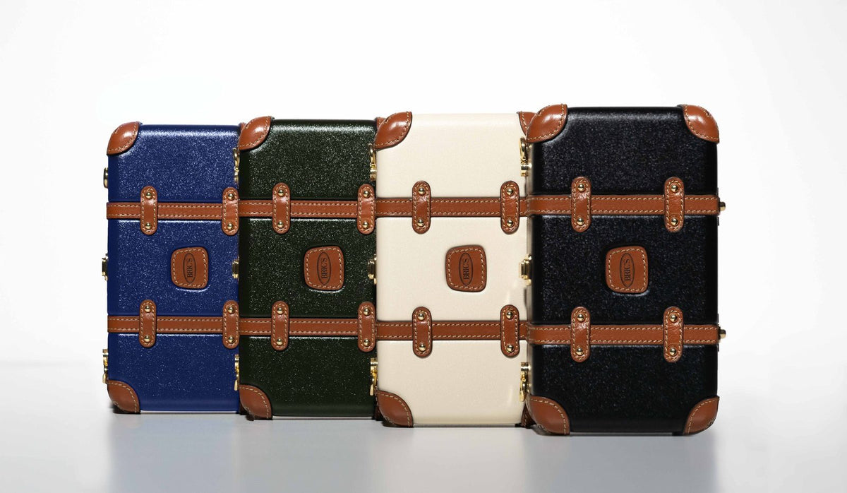 Bric's Bellagio Legacy mini crossbody bags in blue, olive, cream and black lined up side by side
