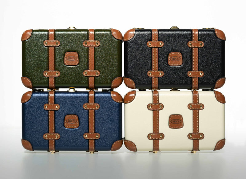 Four Bric's Bellagio Legacy mini crossbody bags in olive, black, blue and cream stacked two by two