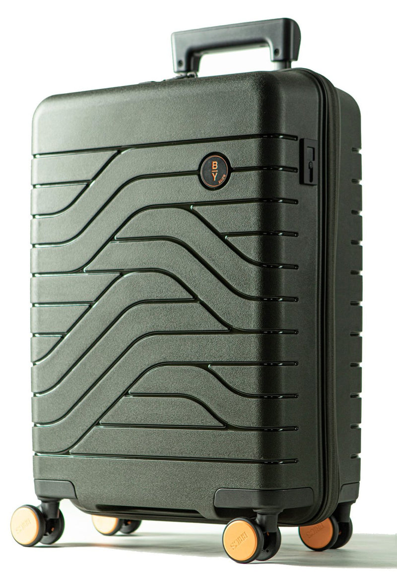 Olive Bric's B|Y Ulisse spinner suitcase from the front corner with orange wheels